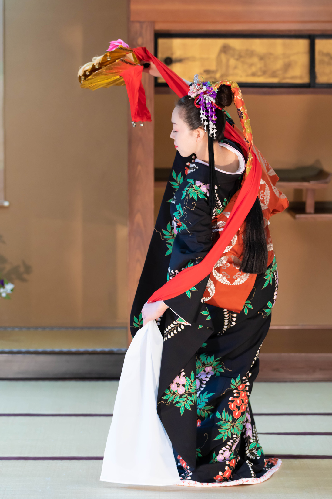 Young Japanese woman in kimono dancing Japanese traditional dance with fan